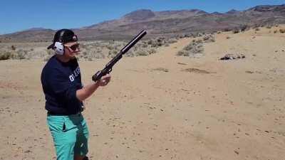 Suppressed .50 deagle, still loud enough to ring your ears with supers but, quieter than expected.