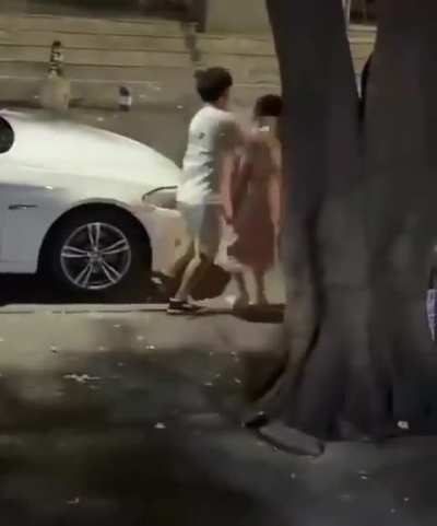 Dude let's woman slap him twice but knocks her out when she touches his car.