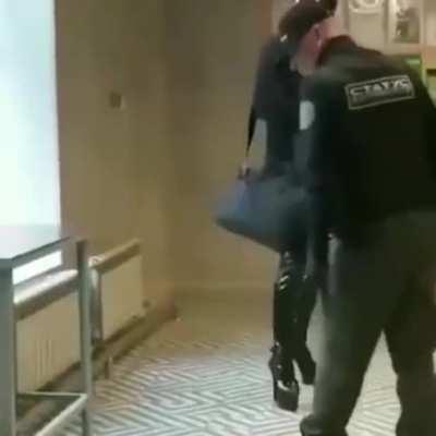 Weird Russian dude messing with the wrong security guard