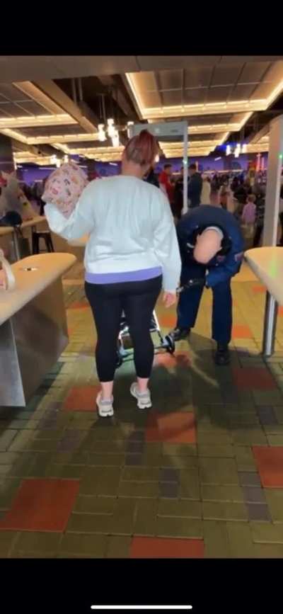 Trying to sneak a bottle of wine into Disneyland.