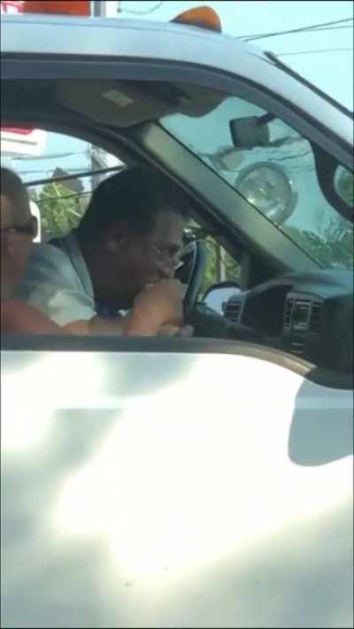 My guy's gobbling her foot ankle deep in traffic.