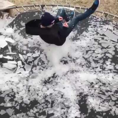 Breaking ice on a trampoline