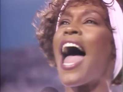 Whitney Houston performs the U.S. National Anthem at the 25th Super Bowl in 1991, ten days into Operation Desert Storm, where nearly 700,000 American troops were deployed.