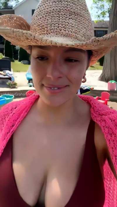 Ashley Graham bouncing boobs while walking around in a burgundy swimsuit