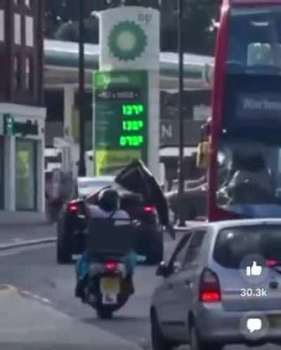 The results of driving with your Tesla door up.