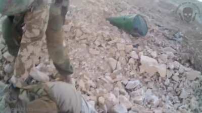 Russian stormtrooper shoots two down ISIS fighters in the head, and then is wounded by a grenade. Palmyra, Syria, 2017