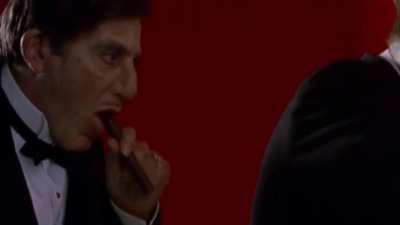 In Dick Tracy (1990), Al Pacino does this to a cigar for some reason, and it's literally the worst thing I've ever seen with my mortal fucking eyes