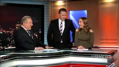 Australian news presenter Tony Jones attempts to kiss co-host Bec Judd on live television.