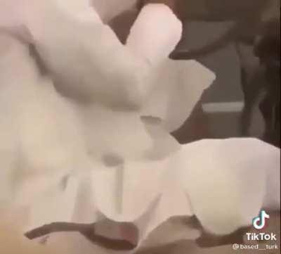 A normal guy driving a normal car while eating chocolate Nutella with his fingers