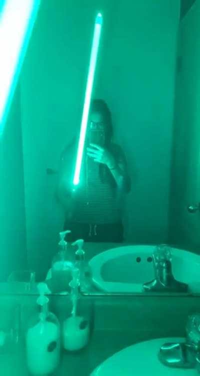 Best place to show off a lightsaber: the bathroom
