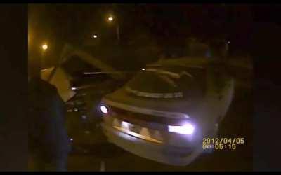 Truck flips over 2 cars