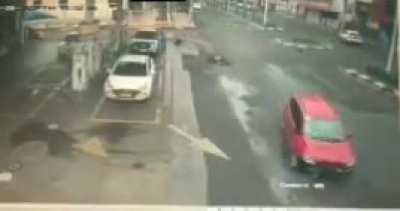 Biker gets hit by passing car in a roundabout - Motorcyclist suffered from heavy back injuries and broken vertebrae and must undergo surgery