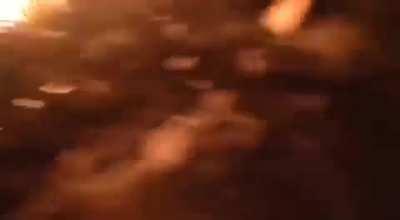 Ukrainian citizens taking their anger out on a Russian APC