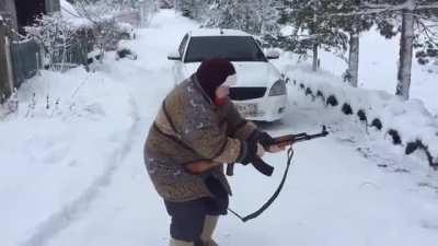 Babushka shooting an AK