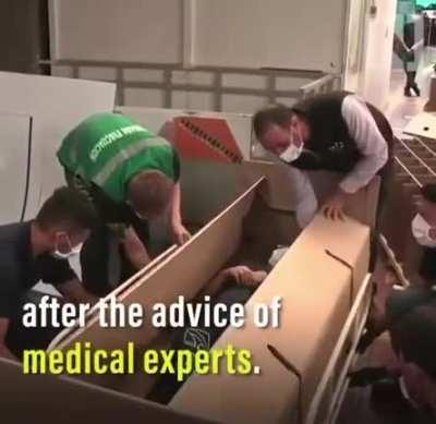 They invented a cardboard bed that can be converted into a coffin for Covid patients.