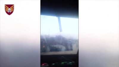 Drone footage of Ukrainian soldiers in a British Husky armored vehicle driving to a Russian position and throwing in a TM-62 anti-tank mine.