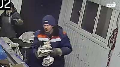 Guy sorting garbage saves a cat that was sealed in a bag and thrown away