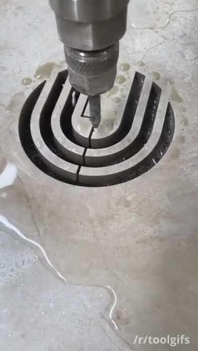 Water jet cutting through stone