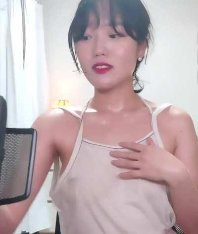 Korean girl shows off her hard nipples