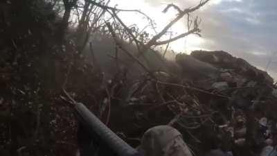 Ukrainian soldier recorded the moment when, during an assault on Russian positions in the Donetsk region, one of the fighters received a bullet in his helmet, elbow and backpack, where a grenade exploded. Despite this, the fighter survived, escaping with 