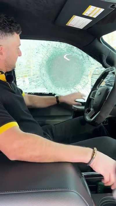 Bullet proof window stops a .50 BMG round.