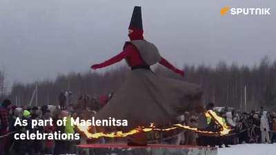 Why are they burning a giant black cube?