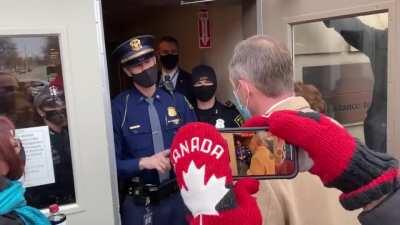 State trooper prevents Republican electors from entering Michigan State House to cast votes for Trump in Electoral College