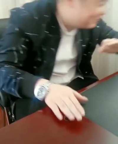 Guy trying to break a walnut