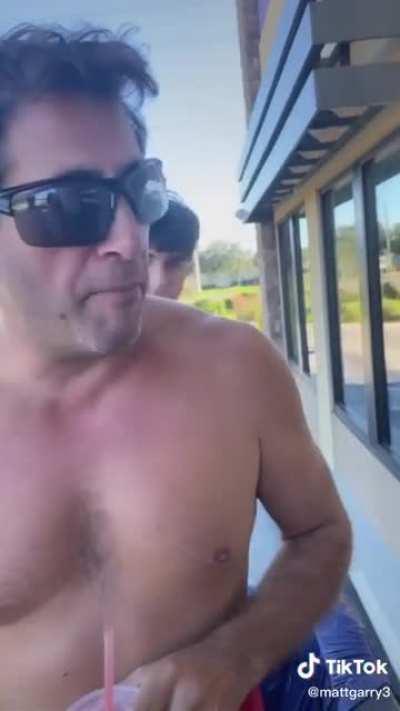 Splashing fast food workers with water