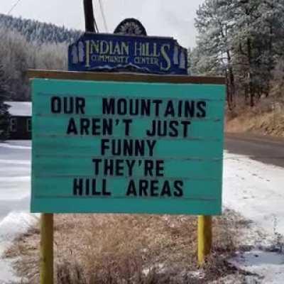 Mountain town's sign on their main road.