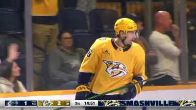 Cole Smith gets his stick on the puck and it trickles past Demko