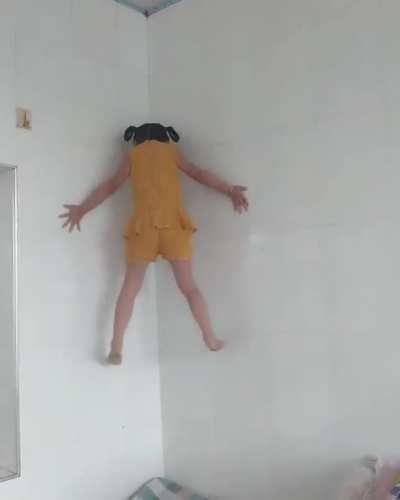 Girl climbing the wall like a spider