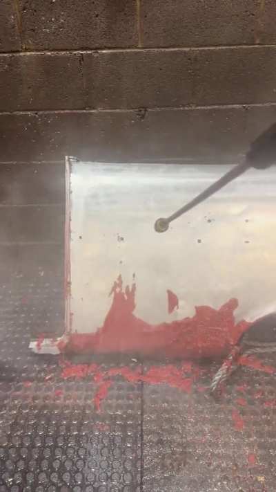 Powerwashing the paint off this Chevy quarter panel after a chemical dip