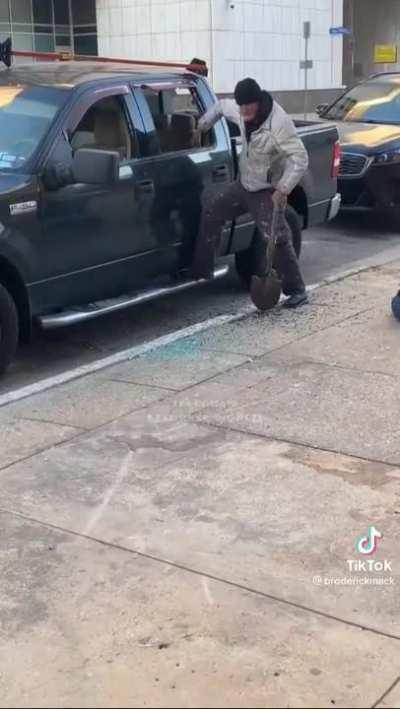 Homeless man breaking into a car in Dallas