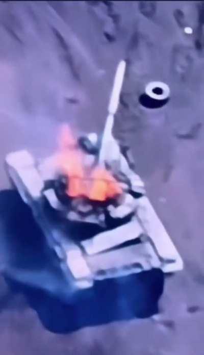 Ukrainian Kamikaze drone causes a Russian tank to cook off.