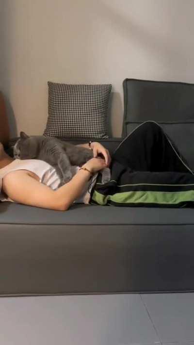 Who wouldn't want a cat sleeping with you like that?