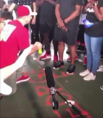 White people kneeling and 