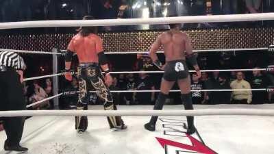 Darby Allin doing a steel chair coffin drop off the balcony to Johnny Mundo and Shane Strickland