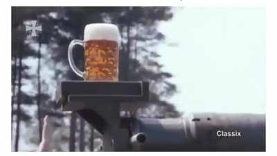 Using a mug of beer to test the gun stabilization on a German Leopard 2 tank
