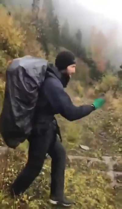 Ukrainian draft-dodgers celebrate their successful border crossing to Moldova. The are shouting 