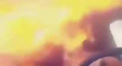 Guy enjoing so munch music he puts fire in his car