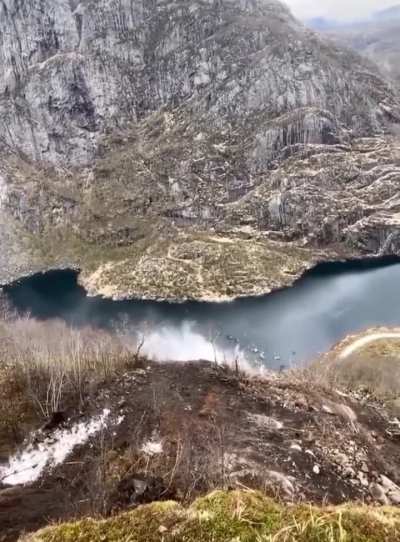 Professionals dropping loose rock in a controlled manner. This prevents rocks randomly falling and crushing people below.