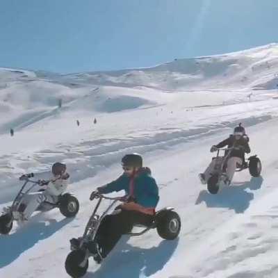 Riding this snowcart down the ski hill with the squad looks really fun