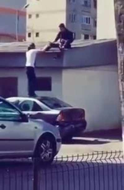 Helping a drunk friend to get to the roof while you're totally drunk too