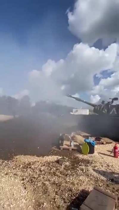 SPG gently reminding soldier where not to stand while firing