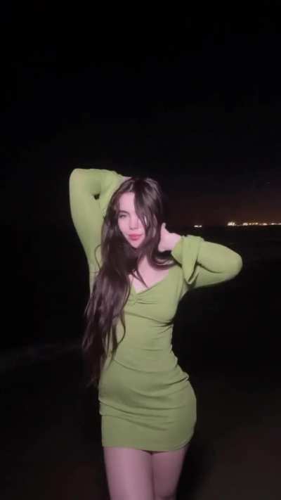 Wearing green dress while at the beach | IG 8/21/24