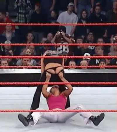 Jackie Gayda pulling down Trish Stratus’s tights