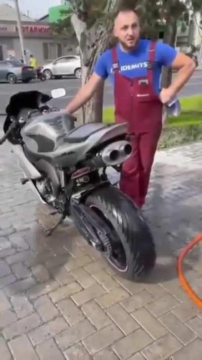 pouring water in bike exhaust.