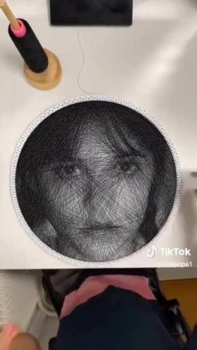 Drawing a face using sewing thread