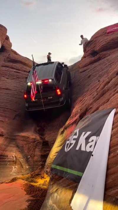 Climbing an SUV on a near-vertical cliff